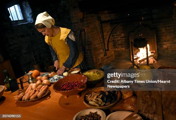 Dawn Elliott dressed in colonial garb prepares the Netherlands dish,hutspot, a root vegetable mash during a Dutch holiday celebration at Crailo State...