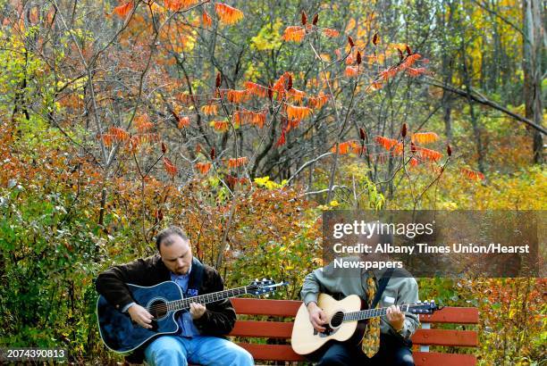 Times Union Staff Photo by Michael P. Farrell ROCK GARDEN--Jason Ellenbogen of Schodack and Chip Kress of Clifton Park practice during their lunch...