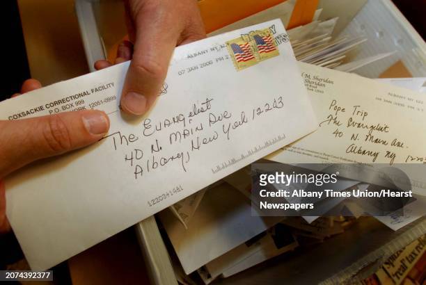 New York --James Breig editor of the Albany diocesan paper the Evangelist sorts through request for tickets to the Popes vist to Yankee Stadium in...