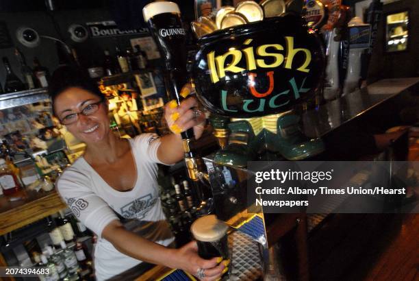 Bartender Erin Jager draws a Guinness at Grainey's on New Scotland Avenue in Albany, New York as local libation establishments gear up for the St....