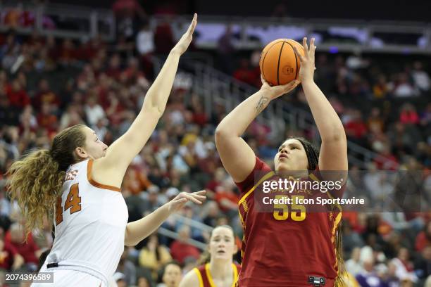 Iowa State Cyclones center Audi Crooks shoots over Texas Longhorns forward Taylor Jones in the third quarter of the women's Big 12 tournament final...