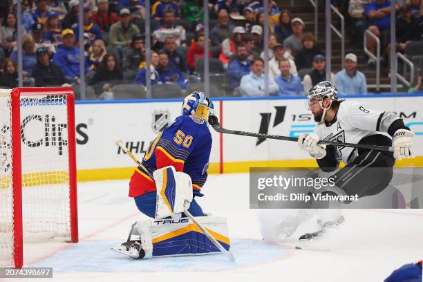Jordan Binnington of the St. Louis Blues makes a save against Drew Doughty of the Los Angeles Kings in the second period at Enterprise Center on...