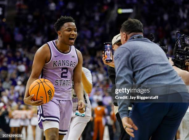 Tylor Perry of the Kansas State Wildcats celebrates after defeating the Texas Longhorns in the second round of the Big 12 Men's Basketball Tournament...