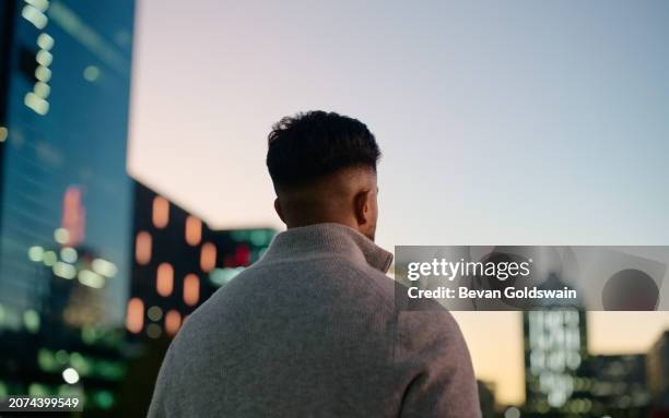 businessman, thinking and cityscape with view on balcony rooftop for corporate vision, professional or office building. male person, back and entrepreneur or london employee commute, urban or town - progress pride stock pictures, royalty-free photos & images