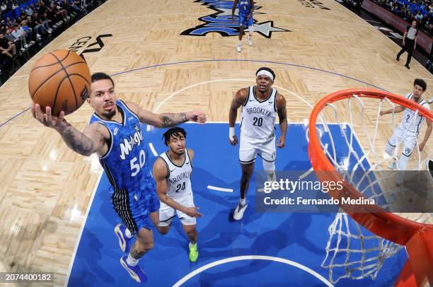 Cole Anthony of the Orlando Magic drives to the basket during the game against the Brooklyn Nets on March 13, 2024 at the Kia Center in Orlando,...