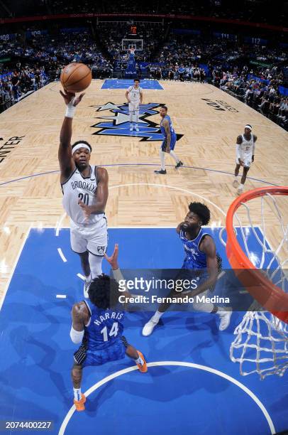 Day'Ron Sharpe of the Brooklyn Nets drives to the basket during the game against the Orlando Magic on March 13, 2024 at the Kia Center in Orlando,...
