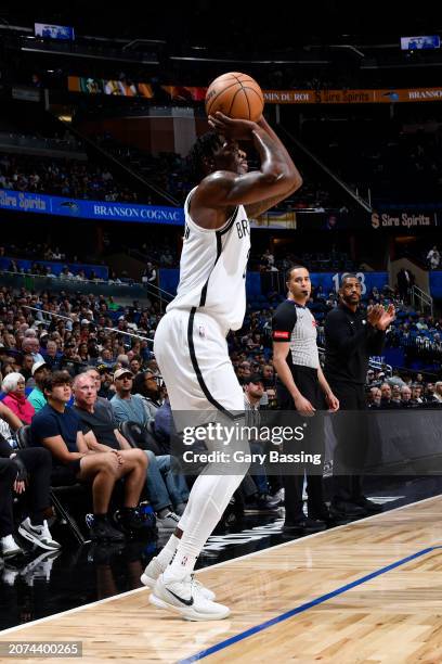 Dorian Finney-Smith of the Brooklyn Nets shoots the ball during the game against the Orlando Magic on March 13, 2024 at the Kia Center in Orlando,...