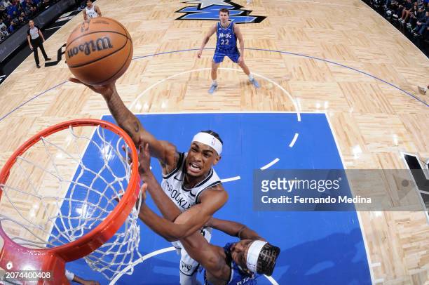 Nicolas Claxton of the Brooklyn Nets drives to the basket during the game against the Orlando Magic on March 13, 2024 at the Kia Center in Orlando,...