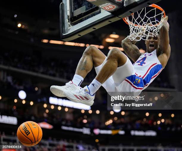Adams Jr. #24 of the Kansas Jayhawks dunks the ball during the first half in the second round against the Cincinnati Bearcats of the Big 12 Men's...