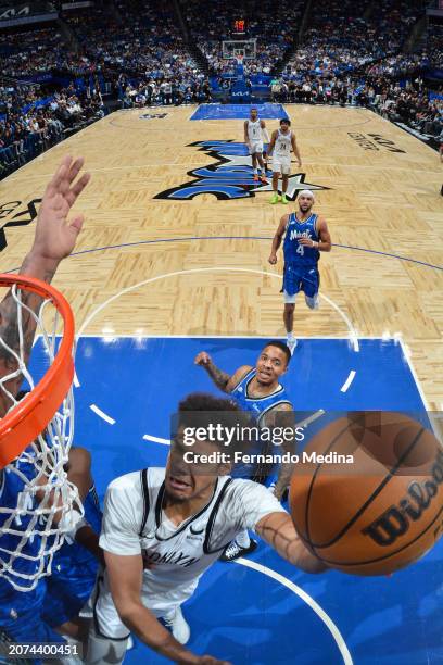 Cameron Johnson of the Brooklyn Nets drives to the basket during the game against the Orlando Magic on March 13, 2024 at the Kia Center in Orlando,...
