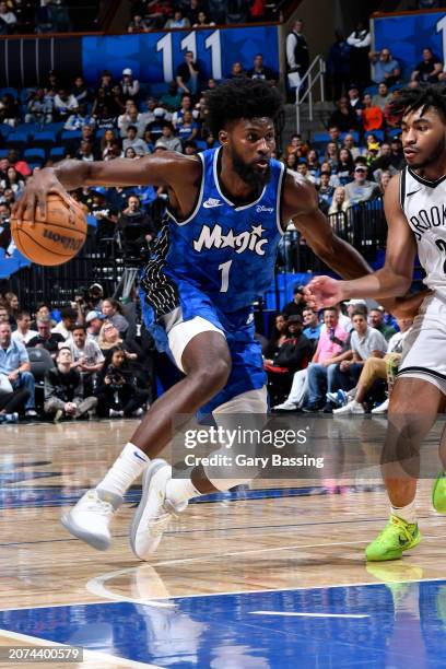 Jonathan Isaac of the Orlando Magic dribbles the ball during the game against the Brooklyn Nets on March 13, 2024 at the Kia Center in Orlando,...