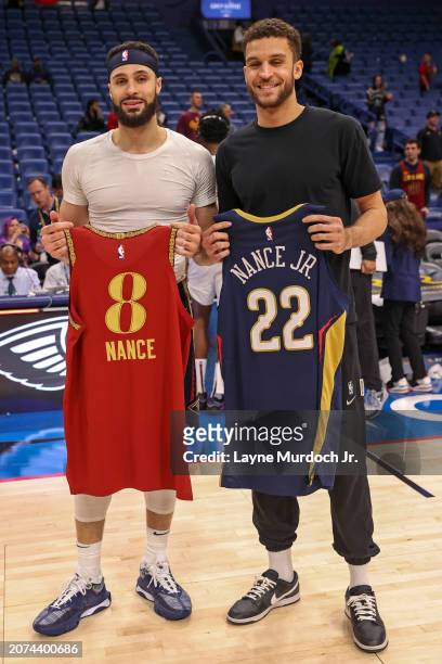Pete Nance of the Cleveland Cavaliers and Larry Nance Jr. #22 of the New Orleans Pelicans swap jerseys after the game on March 13, 2024 at the...