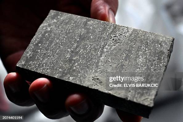 Ore Core Sample An employee shows a core sample of lithium ore found near... News Photo ...
