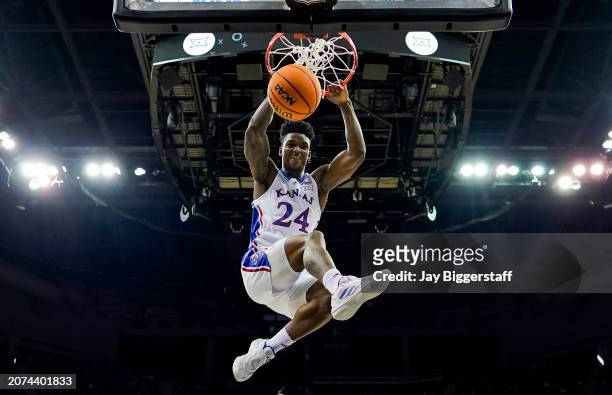 Adams Jr. #24 of the Kansas Jayhawks dunks the ball during the first half against the Cincinnati Bearcats in the second round of the Big 12 Men's...