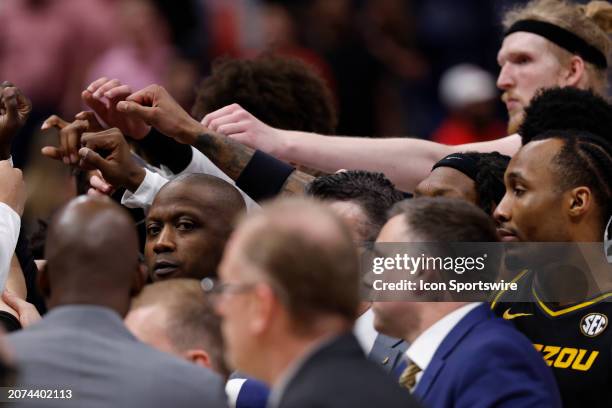 Missouri Tigers head coach Dennis Gates looks off into the crowd as his team huddles at mid-court following a 64-59 loss in a first round game of the...