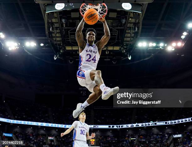 Adams Jr. #24 of the Kansas Jayhawks dunks the ball during the first half against the Cincinnati Bearcats in the second round of the Big 12 Men's...