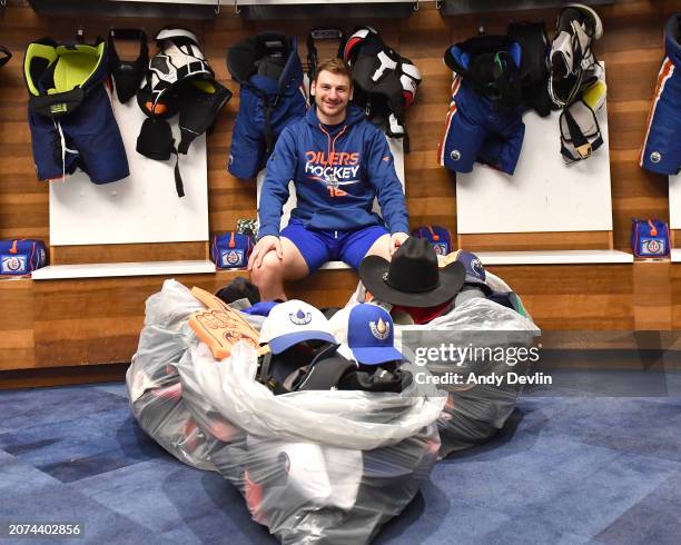 Zach Hyman of the Edmonton Oilers is pictured with the hats from his hat-trick after the game against the Washington Capitals at Rogers Place on...