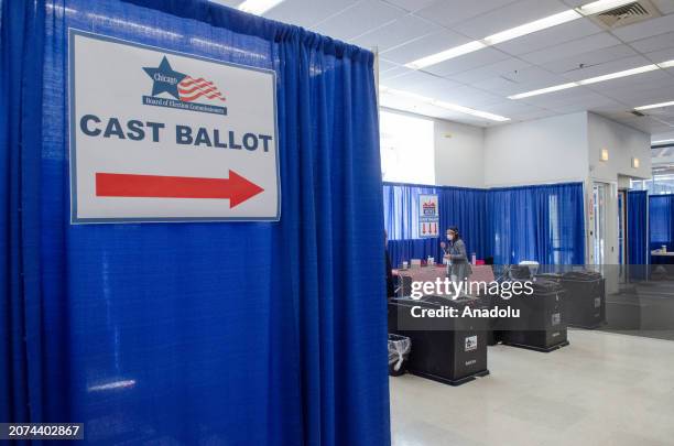 Voters cast their ballots at a polling station for the 2024 primary elections during early voting ahead of the election day in Chicago, Illinois,...
