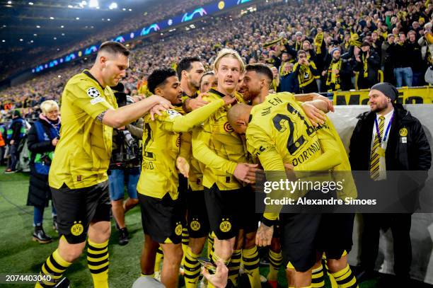 Jaden Sancho of Borussia Dortmund celebrates with his teammates after scoring the 1-0 lead during the UEFA Champions League 2023/24 round of 16...