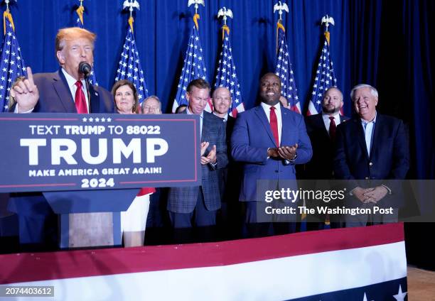 February 24 : Sen. Tim Scott and Sen. Lindsey Graham listen as Republican presidential candidate former president Donald Trump speaks during a South...