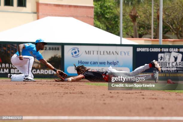 Washington Nationals right fielder James Wood steals second base against the Miami Marlins on March 13 at Roger Dean Chevrolet Stadium in Jupiter,...