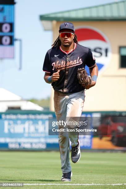 Washington Nationals right fielder James Wood jogs off the field in between innings during a game against the Miami Marlins on March 13 at Roger Dean...