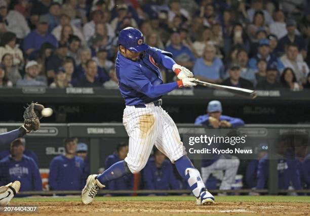 Seiya Suzuki of the Chicago Cubs strikes out swinging in the fourth inning of a spring training baseball game against the Milwaukee Brewers in Mesa,...