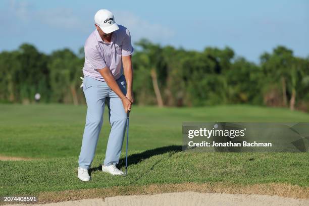 Brice Garnett of the United States chips to the 18th green during the final round of the Puerto Rico Open at Grand Reserve Golf Club on March 10,...