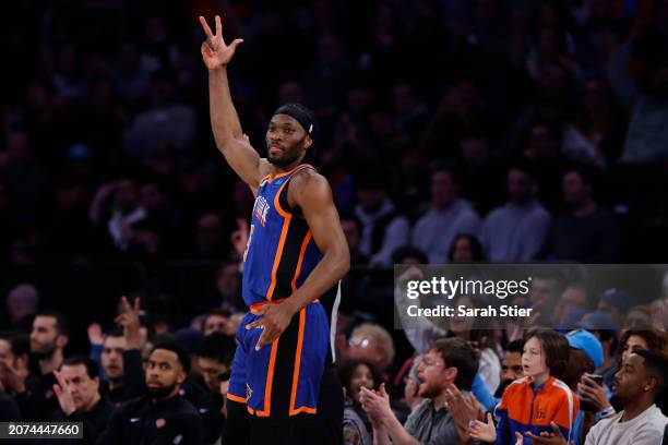 Precious Achiuwa of the New York Knicks reacts after scoring during the first half against the Philadelphia 76ers at Madison Square Garden on March...