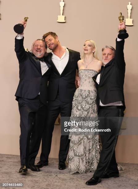 Dave Mullins, presenters Chris Hemsworth and Anya Taylor-Joy, and Brad Booker, winners of Best Animated Short Film award for 'War is Over' pose in...