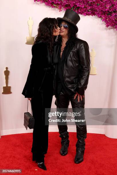 Meegan Hodges and Slash attend the 96th Annual Academy Awards on March 10, 2024 in Hollywood, California.