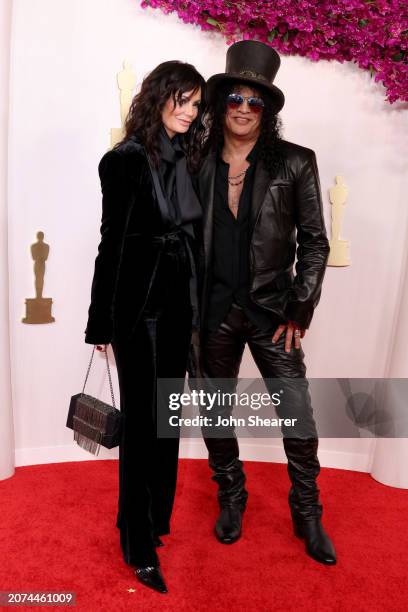 Meegan Hodges and Slash attend the 96th Annual Academy Awards on March 10, 2024 in Hollywood, California.