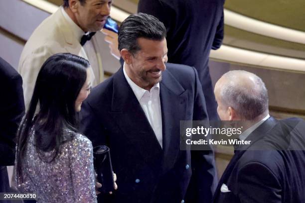 Clara Wong, Bradley Cooper, and Paul Giamatti in the audience during the 96th Annual Academy Awards at Dolby Theatre on March 10, 2024 in Hollywood,...