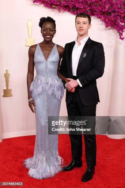 Lupita Nyong'o and Joseph Quinn attend the 96th Annual Academy Awards on March 10, 2024 in Hollywood, California.