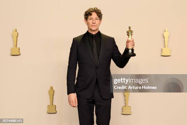 Director, Jonathan Glazer, winner of the Best International Feature for “The Zone of Interest”, poses in the press room during the 96th Annual...