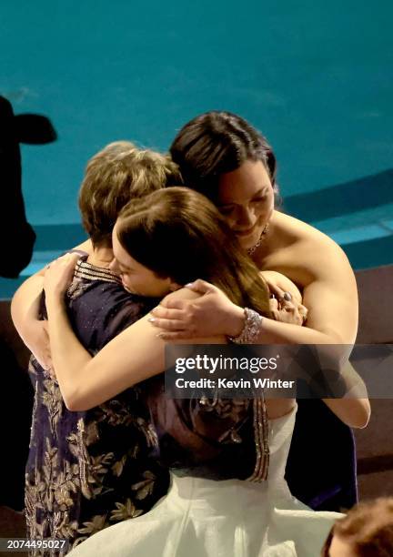 Annette Bening, Emma Stone, and Lily Gladstone embrace in the audience during the 96th Annual Academy Awards at Dolby Theatre on March 10, 2024 in...