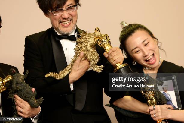 Takashi Yamazaki and Kiyoko Shibuya, winners of the Best Visual Effects award for “Godzilla Minus One”, pose in the press room during the 96th Annual...