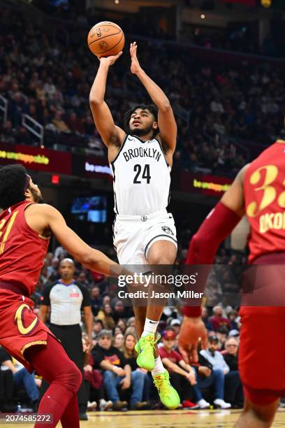 Cam Thomas of the Brooklyn Nets shoots over Jarrett Allen of the Cleveland Cavaliers during the second quarter at Rocket Mortgage Fieldhouse on March...