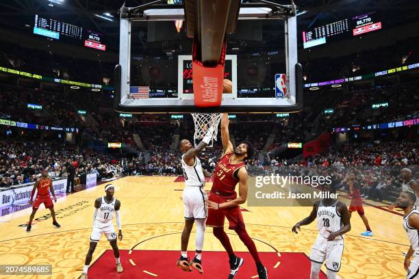 Jarrett Allen of the Cleveland Cavaliers dunks over Lonnie Walker IV of the Brooklyn Nets during the second quarter at Rocket Mortgage Fieldhouse on...