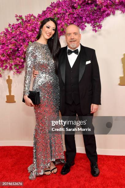 Clara Wong and Paul Giamatti attends the 96th Annual Academy Awards on March 10, 2024 in Hollywood, California.