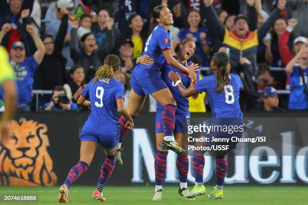 Lynn Williams of the United States celebrates scoring a goal with teammates that would be waved off for offsides during the second half against...
