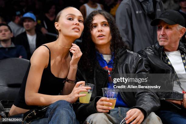 Lily-Rose Depp and musician 070 Shake attend a basketball game between the Los Angeles Lakers and the Minnesota Timberwolves at Crypto.com Arena on...