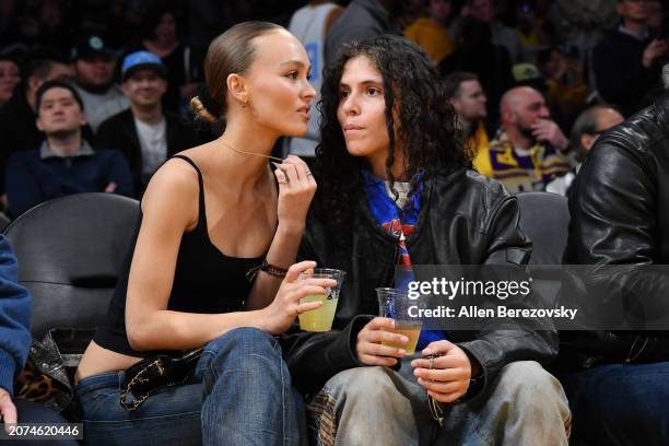 Lily-Rose Depp and musician 070 Shake attend a basketball game between the Los Angeles Lakers and the Minnesota Timberwolves at Crypto.com Arena on...