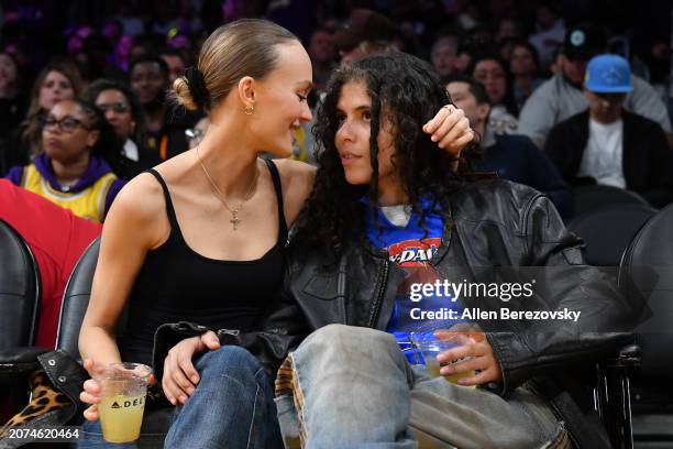 Lily-Rose Depp and musician 070 Shake attend a basketball game between the Los Angeles Lakers and the Minnesota Timberwolves at Crypto.com Arena on...