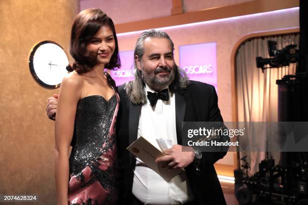 In this handout photo provided by A.M.P.A.S., Zendaya and Hoyte van Hoytema are seen backstage during the 96th Annual Academy Awards at Dolby Theatre...