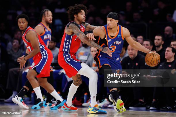 Josh Hart of the New York Knicks dribbles against Kelly Oubre Jr. #9 of the Philadelphia 76ers during the first half at Madison Square Garden on...