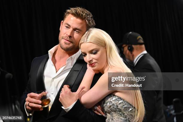 In this handout photo provided by A.M.P.A.S., Chris Hemsworth and Anya Taylor-Joy are seen backstage during the 96th Annual Academy Awards at Dolby...