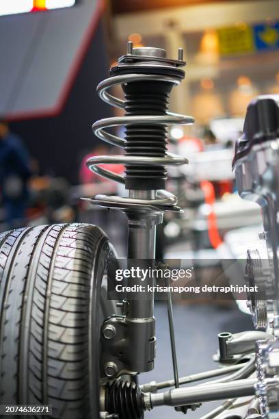 close up of automobile shock absorbers and springs - shock absorber stock pictures, royalty-free photos & images