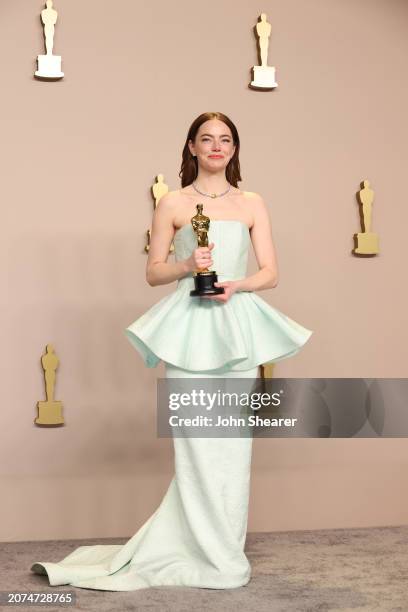 Emma Stone, winner of the Best Actress in a Leading Role award for “Poor Things”, poses in the press room during the 96th Annual Academy Awards at...