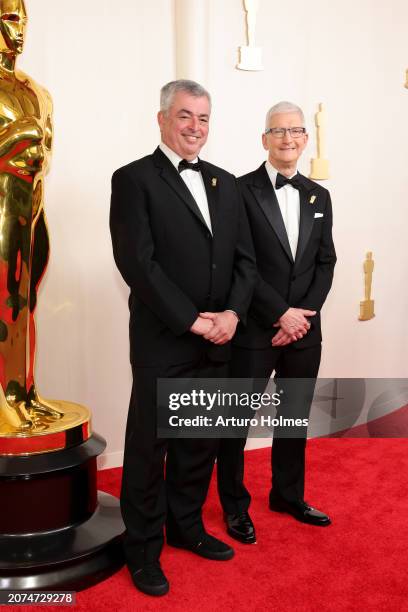 Eddy Cue and Tim Cook attend the 96th Annual Academy Awards on March 10, 2024 in Hollywood, California.